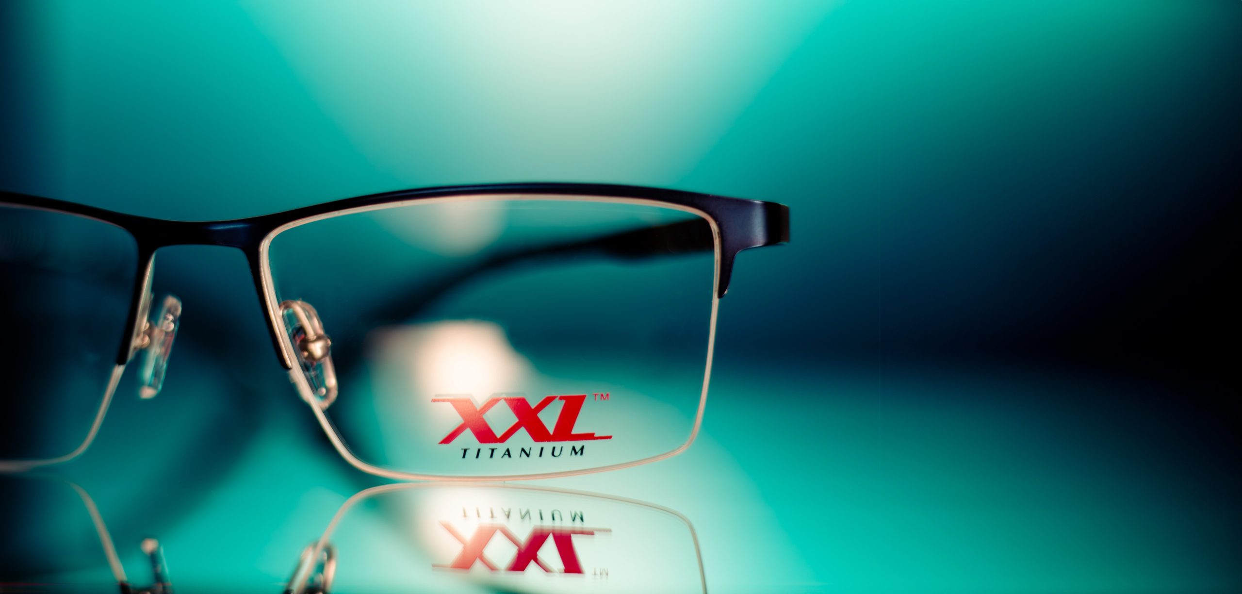 XXL frames on blue background and reflective surface